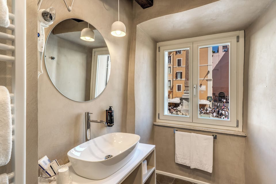 Double Pantheon view mezzanine floor | Bathroom | Hair dryer, slippers, bidet, towels
