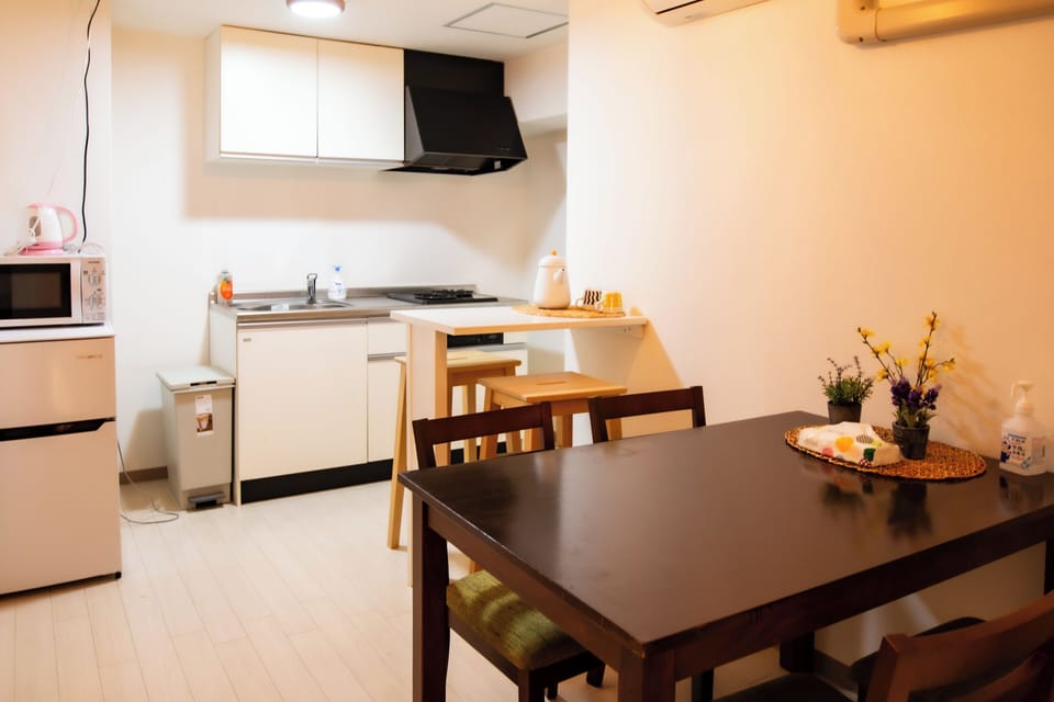 Apartment | Private kitchen | Full-size fridge, microwave, stovetop, cookware/dishes/utensils