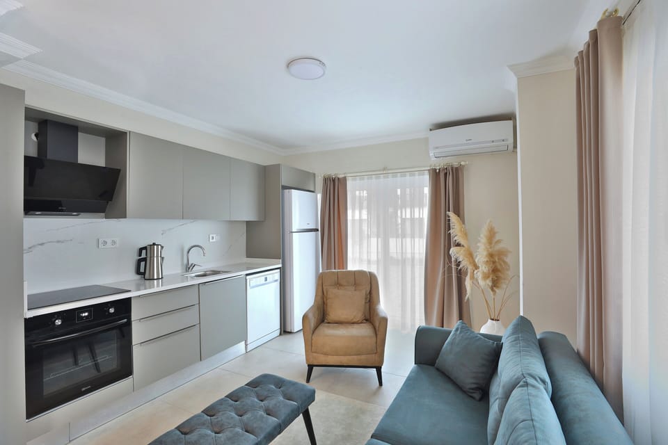 Deluxe Condo, 2 Bedrooms, Kitchen | Living area | 32-inch flat-screen TV with satellite channels, TV