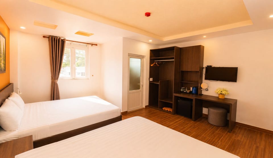 Family Quadruple Room | Minibar, desk, laptop workspace, soundproofing