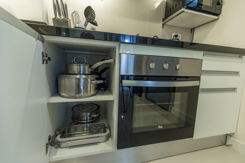 Comfort Townhome, Patio | Private kitchen | Electric kettle, highchair