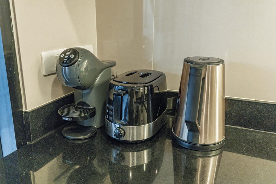 Comfort Townhome, Patio | Private kitchen | Electric kettle, highchair