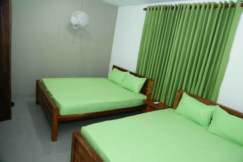 Deluxe Quadruple Room | Desk, laptop workspace, iron/ironing board