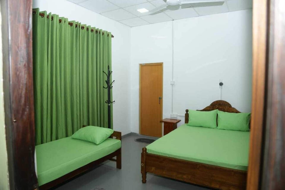 Deluxe Triple Room | Desk, laptop workspace, iron/ironing board
