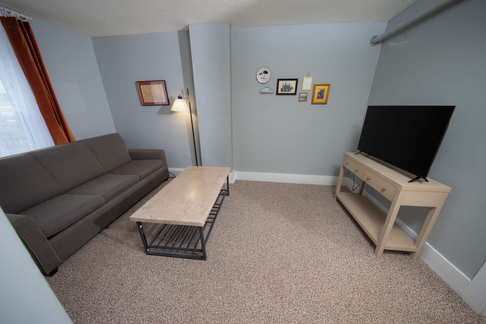 Deluxe Room, 1 Queen Bed with Sofa bed, Accessible, Ground Floor | Living area | Flat-screen TV