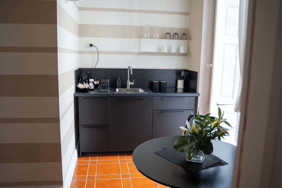 Deluxe Triple Room, Balcony, City View | Private kitchen