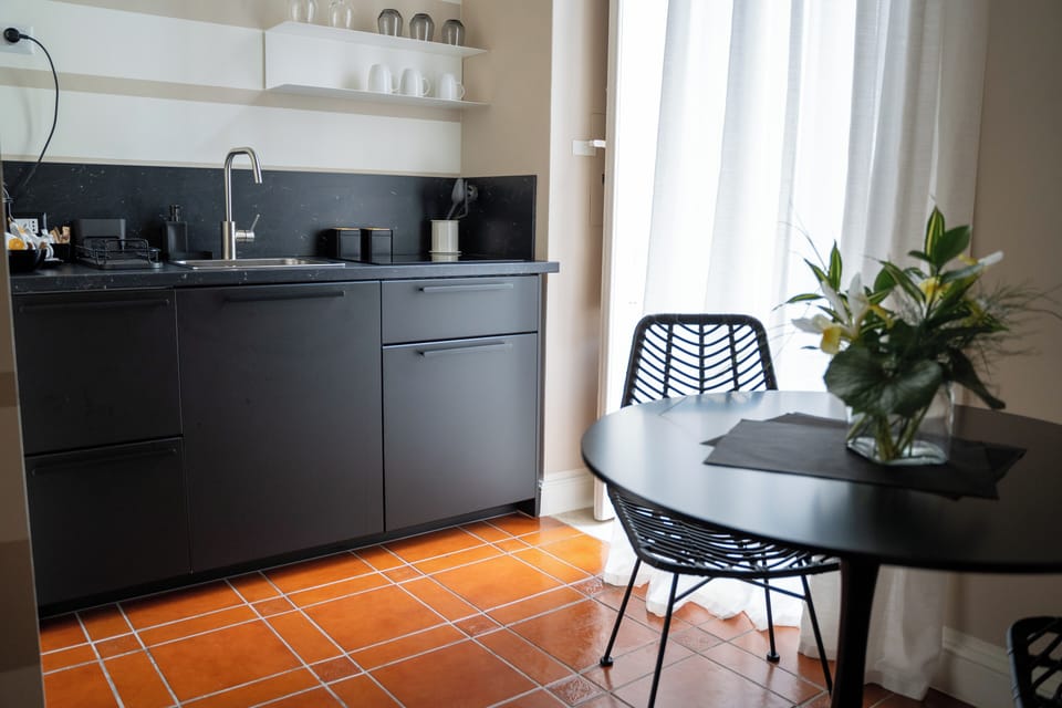 Deluxe Triple Room, Balcony, City View | Private kitchen