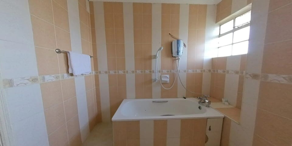 Shower, slippers, towels, soap