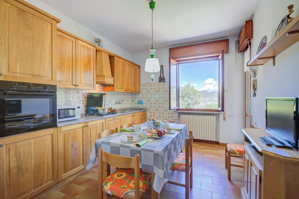 Family Apartment, Multiple Bedrooms (A Due Passi Dal Bosco) | Private kitchen | Fridge, microwave, oven, stovetop