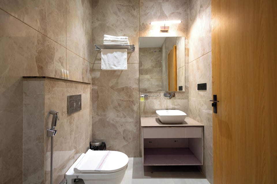 Shower, free toiletries, slippers, towels
