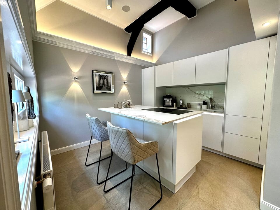 Luxury Suite, Garden View | In-room safe, blackout drapes, soundproofing, iron/ironing board