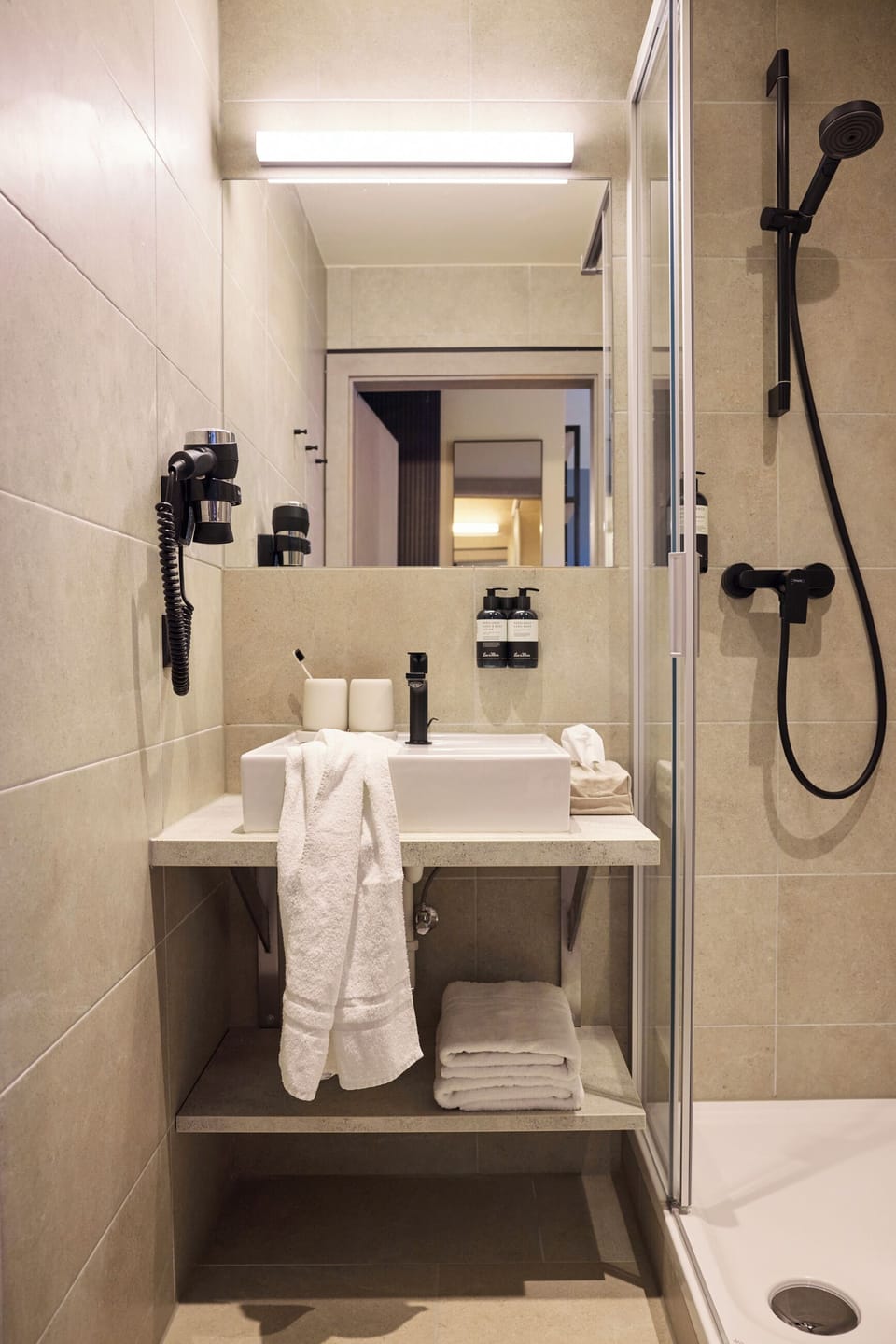 Shower, designer toiletries, hair dryer, bathrobes