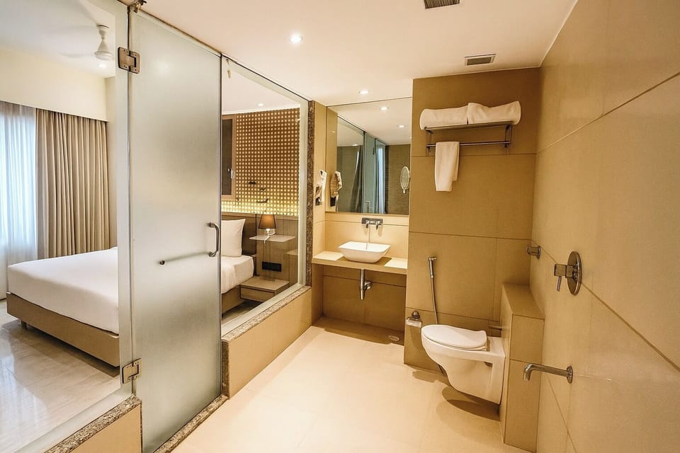Executive Suite, Non Smoking, City View | Bathroom | Shower, free toiletries, hair dryer, slippers