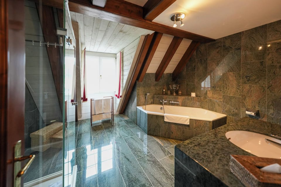 Luxury Duplex, Kitchen, Courtyard View | Bathroom | Hair dryer, slippers, towels, soap