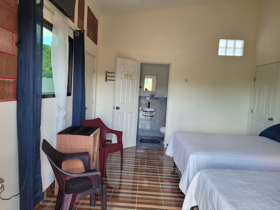 Deluxe Room | Iron/ironing board, WiFi (free), bed sheets