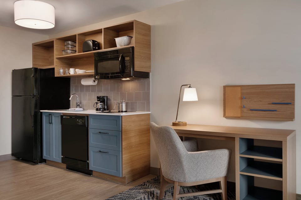Desk, laptop workspace, blackout drapes, iron/ironing board