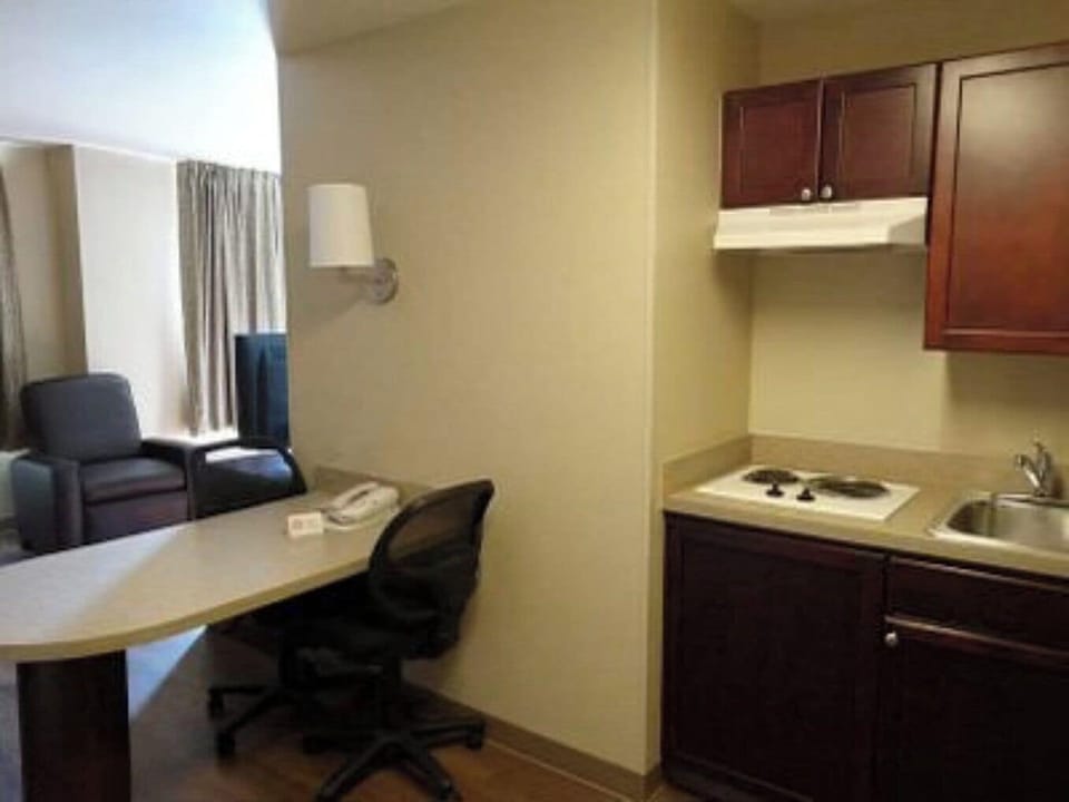 Desk, laptop workspace, blackout drapes, iron/ironing board
