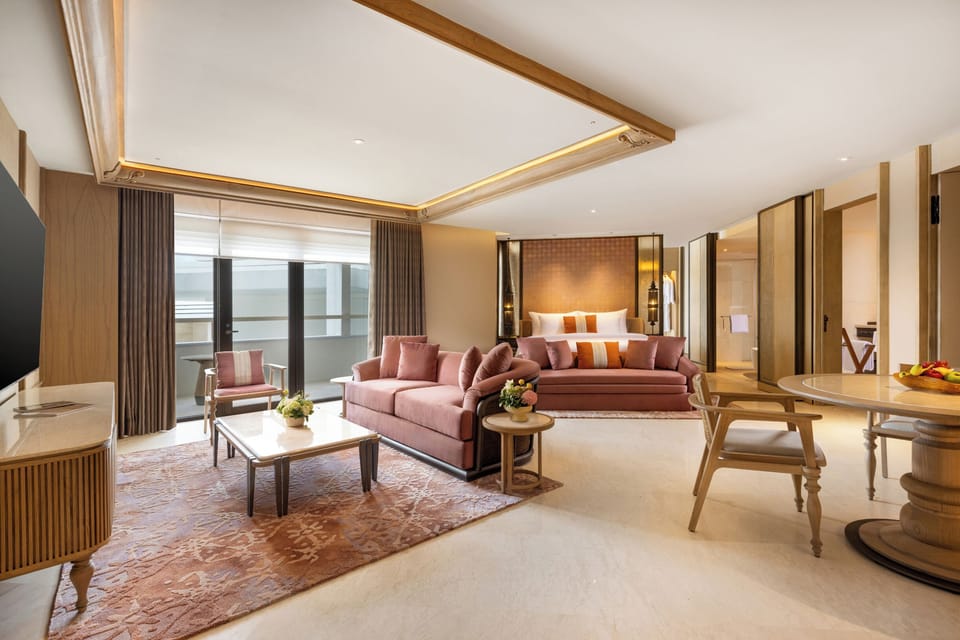 Executive Studio Suite | Living area | 55-inch LED TV with cable channels