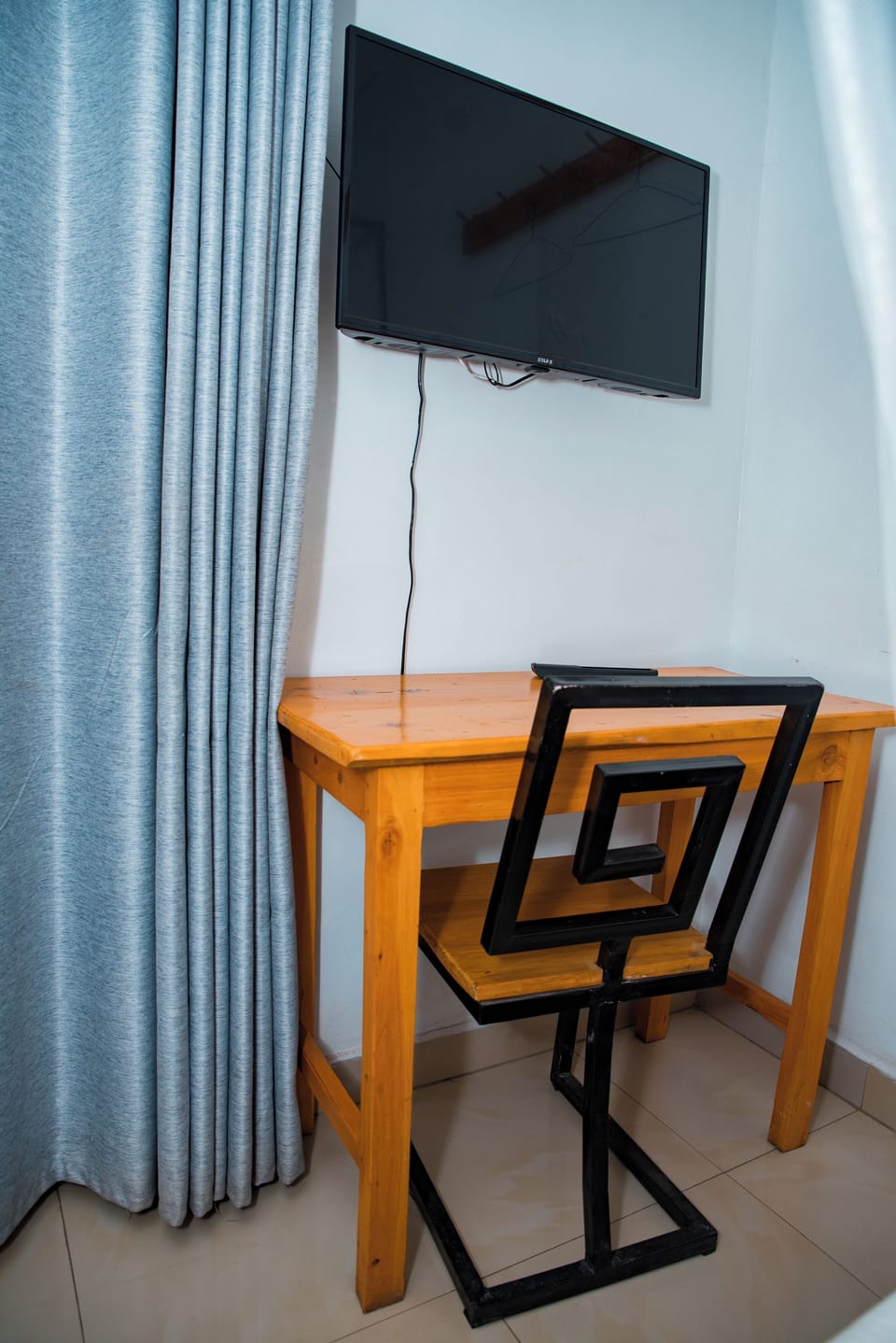 Premium bedding, desk, laptop workspace, blackout drapes