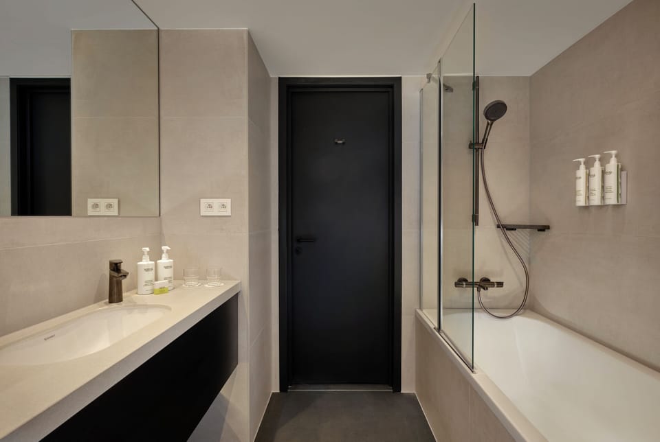 Premium Room, 2 Double Beds | Bathroom | Rainfall showerhead, hair dryer, towels, soap