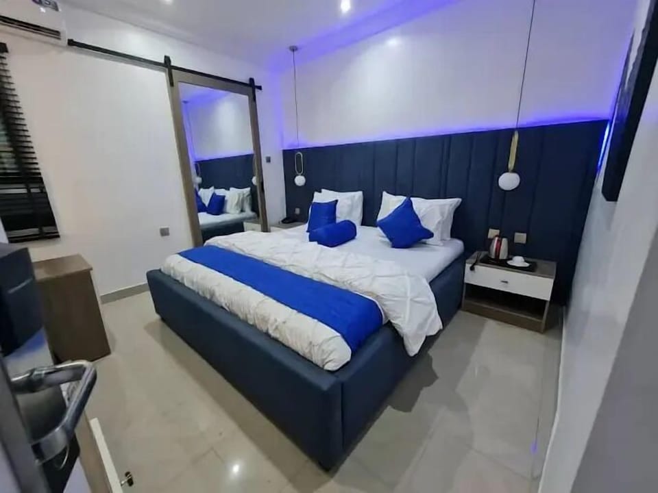 Deluxe Apartment, Balcony, City View | In-room safe, desk, laptop workspace, iron/ironing board