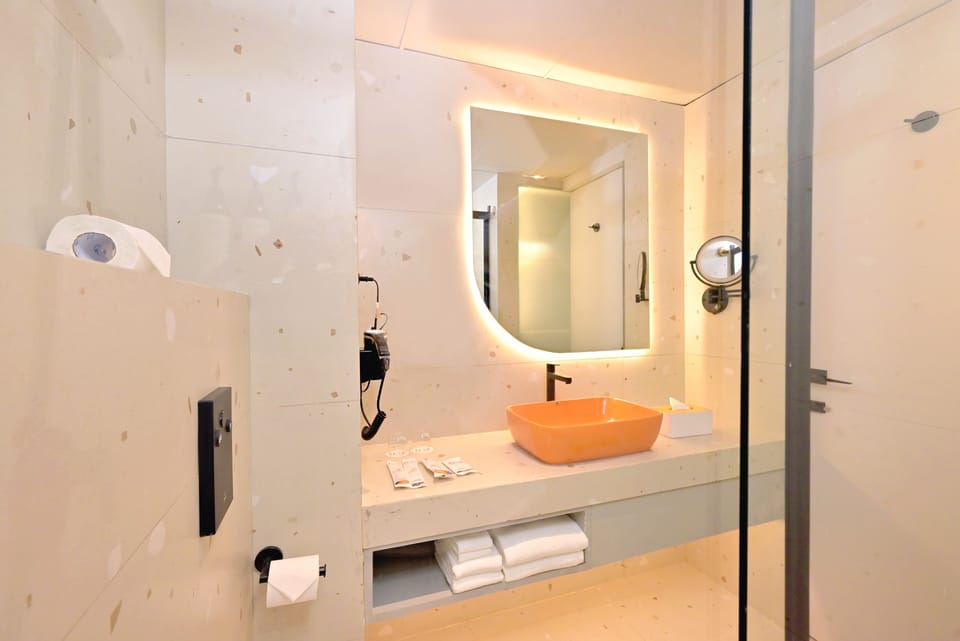 Shower, hair dryer, slippers, towels