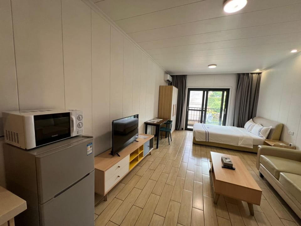 Deluxe Studio, 1 Bedroom, Balcony, Pool View | Desk, blackout drapes, soundproofing, iron/ironing board
