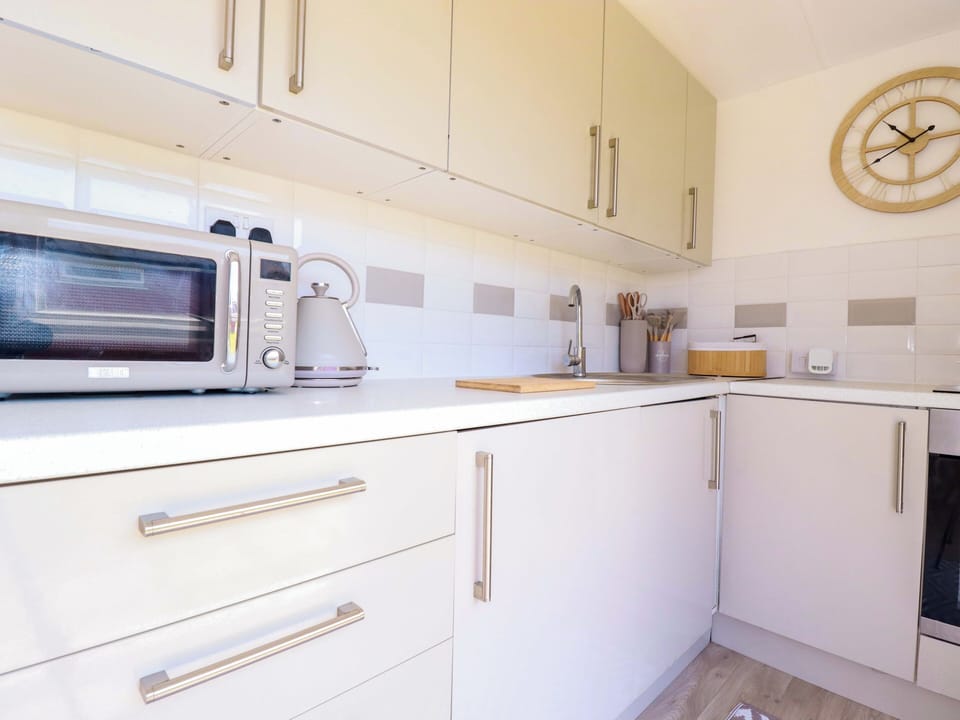 Fridge, microwave, toaster, cookware/dishes/utensils