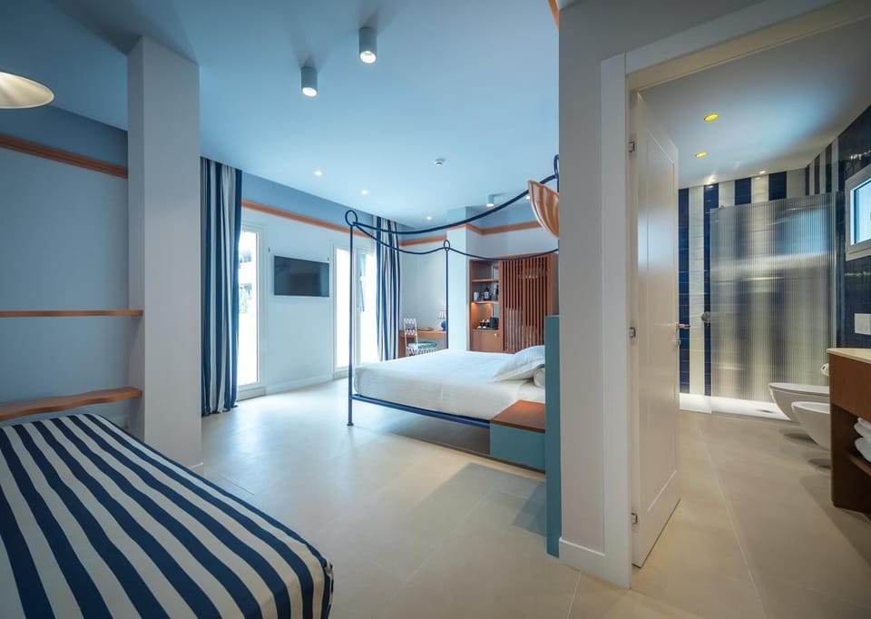 Family Suite, Sea View | Down comforters, minibar, in-room safe, desk