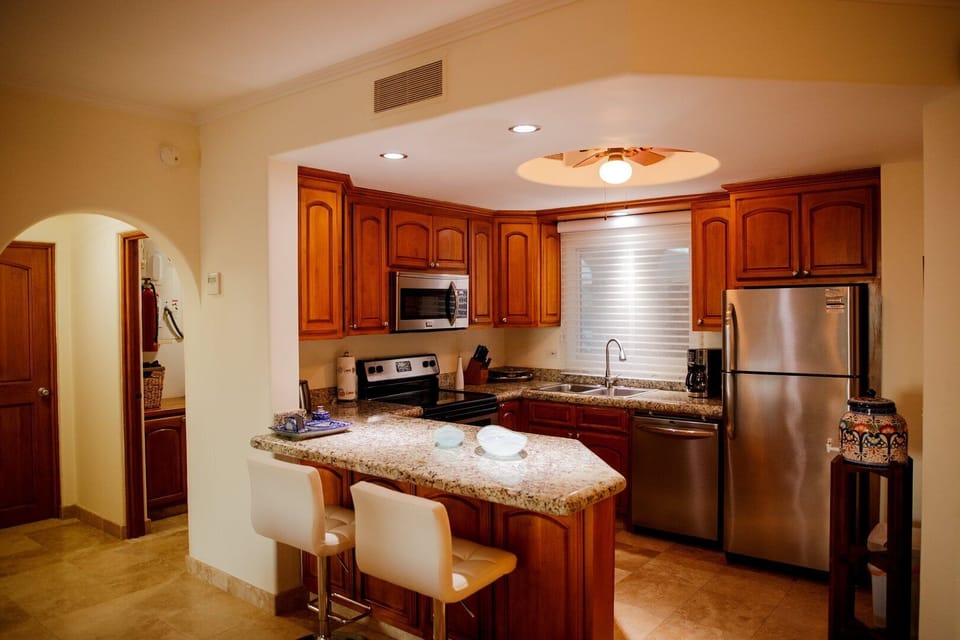 Apartment, Multiple Beds, Balcony, Ocean View (Las Mañanitas LM E3402) | Private kitchen | Dining tables