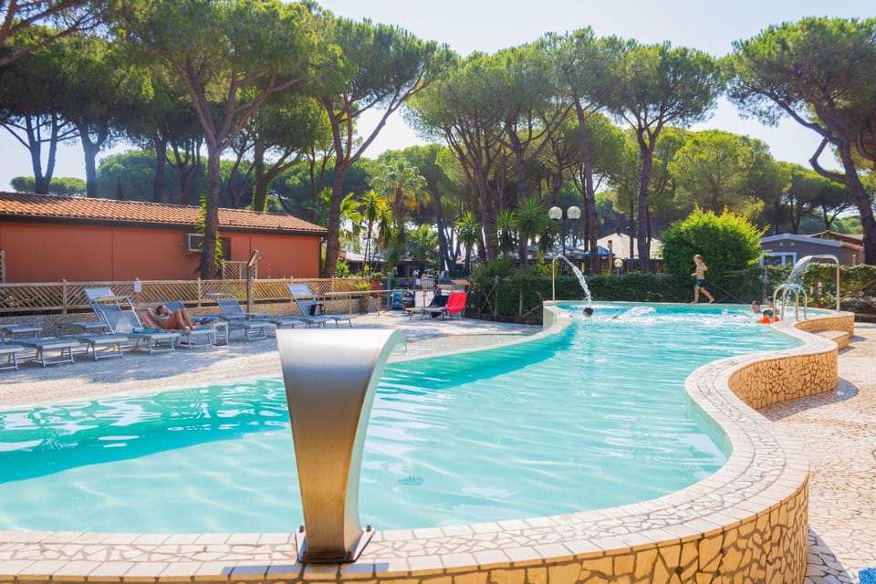 Seasonal outdoor pool, open 9:00 AM to 7:00 PM, pool umbrellas