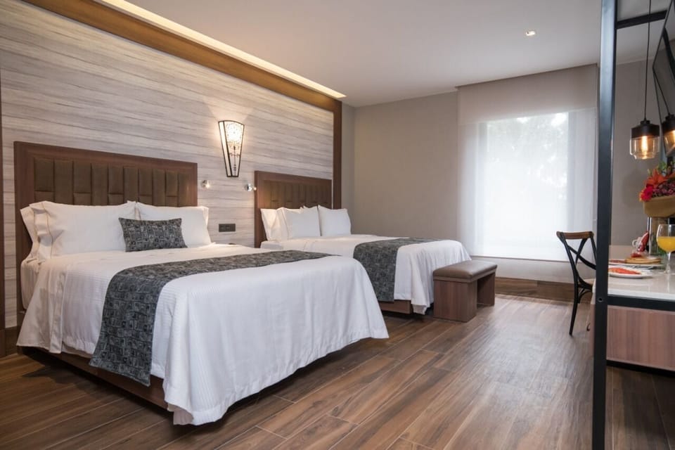 Premium bedding, in-room safe, blackout drapes, soundproofing