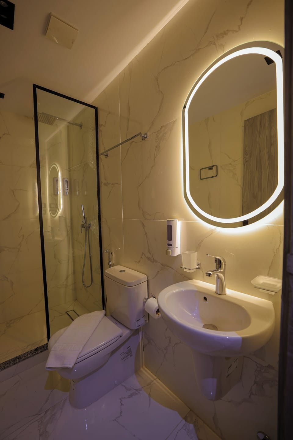 Combined shower/tub, free toiletries, hair dryer, slippers