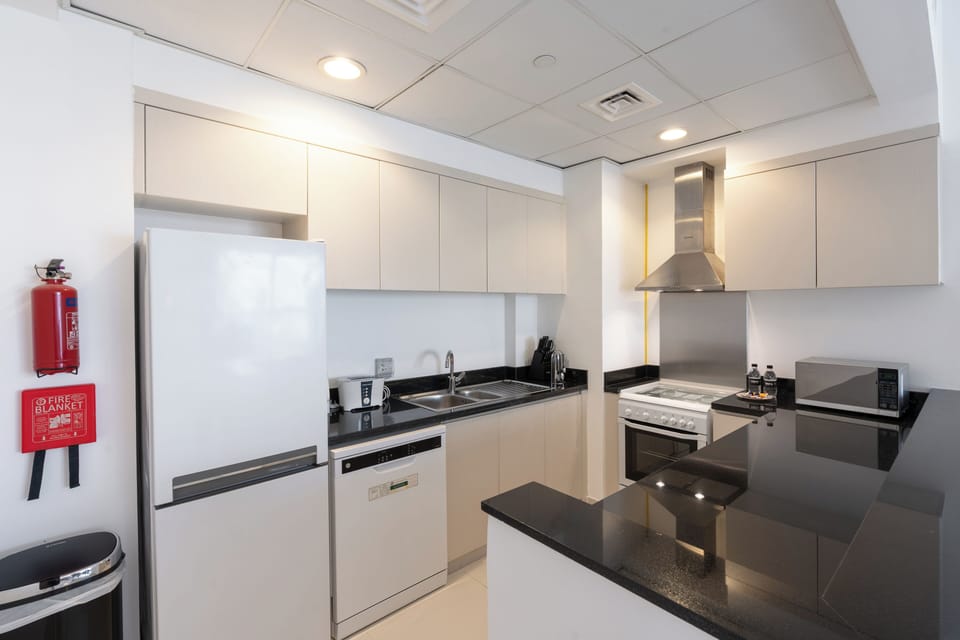 Deluxe Apartment, Balcony, City View | Private kitchen | Espresso maker, electric kettle