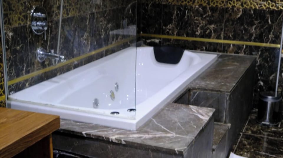 Presidential Suite, City View | Bathroom | Hair dryer, slippers, soap, shampoo