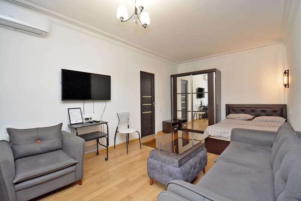 Economy Studio | Living area | 50-inch flat-screen TV with cable channels