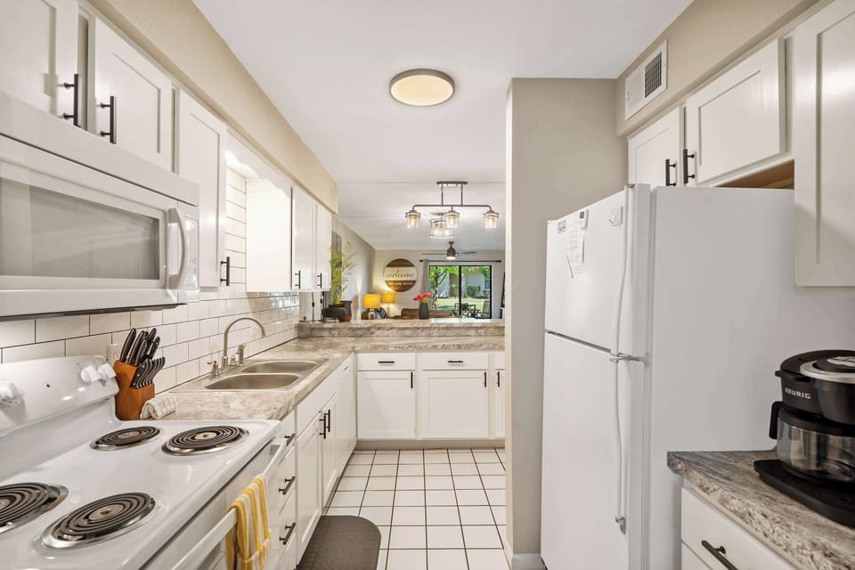 Condo, Multiple Beds, Patio, Garden View (Coffman Escape) | Private kitchen | Fridge, microwave, oven, stovetop
