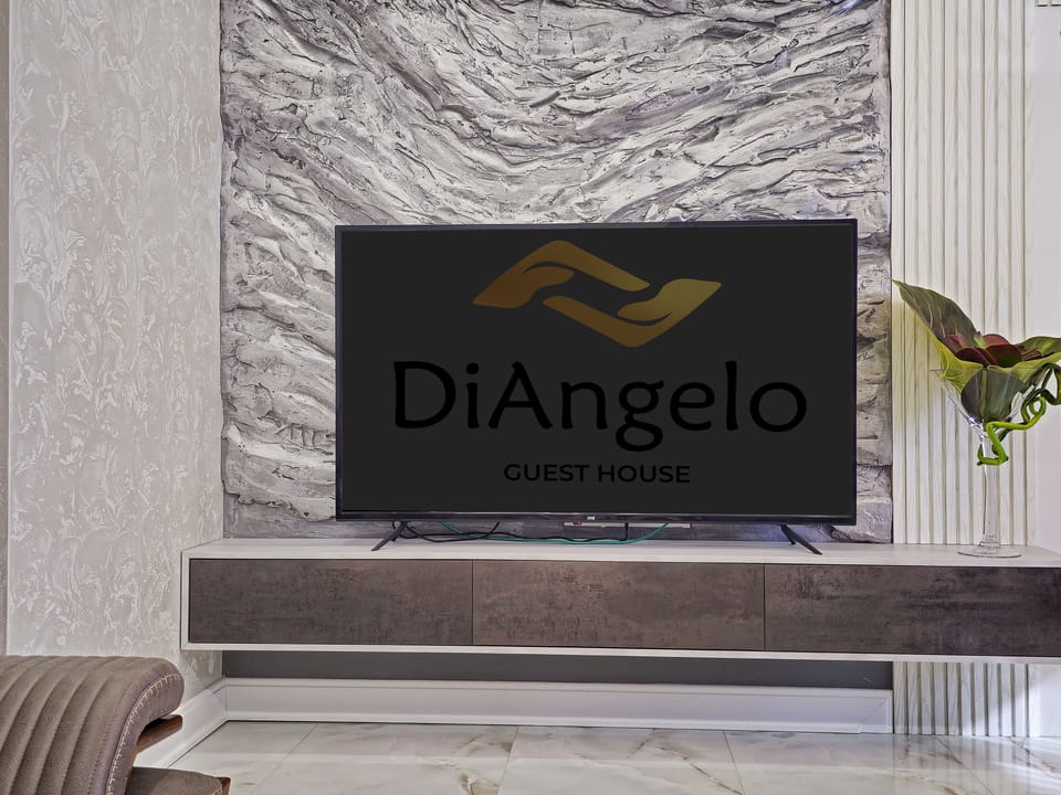 Family Room, 2 Bedrooms, Non Smoking, Kitchen | Living room | 75-inch flat-screen TV with digital channels
