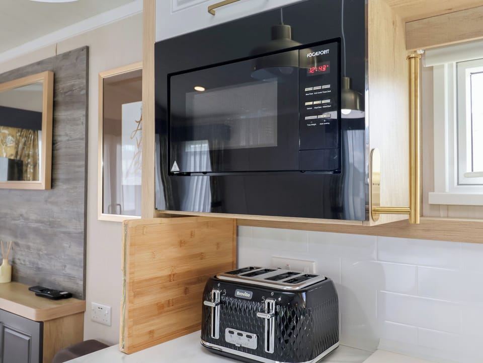 Fridge, microwave, toaster, cookware/dishes/utensils