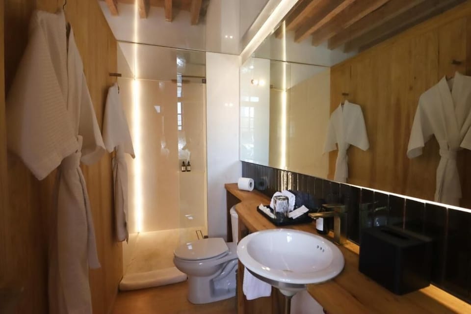Grand Room, Balcony, City View | Bathroom | Shower, rainfall showerhead, designer toiletries, hair dryer