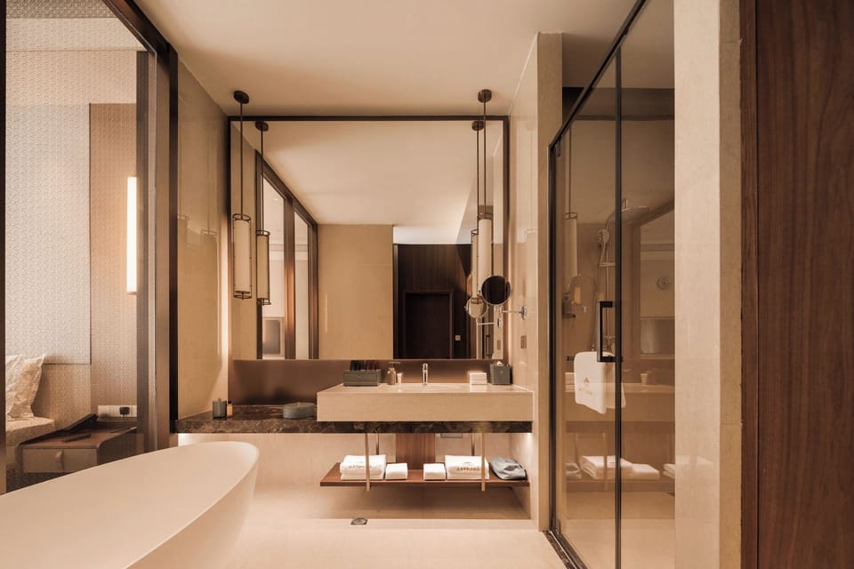Executive Suite King Bed Room | Bathroom | Designer toiletries, hair dryer, bathrobes, towels