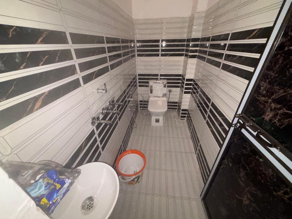 Shower, free toiletries, slippers, towels