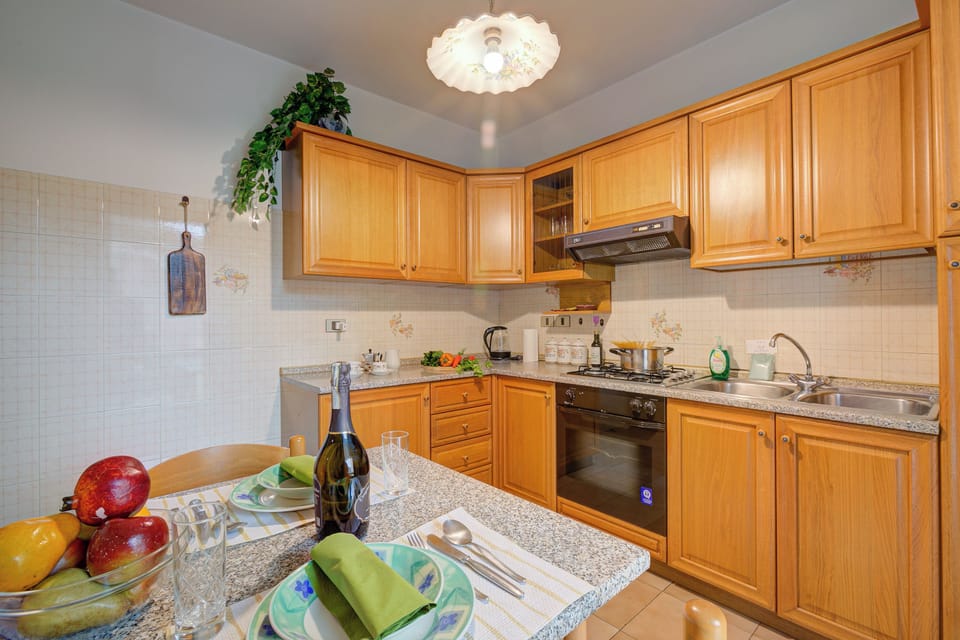 Family Apartment, Multiple Bedrooms, 2 Bathrooms (Lake Garda Home) | Private kitchen | Fridge, oven, stovetop, coffee/tea maker