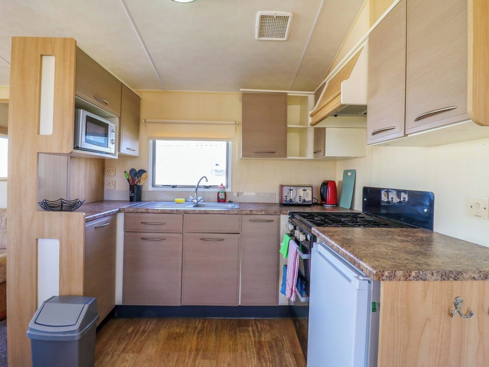 Fridge, microwave, toaster, cookware/dishes/utensils