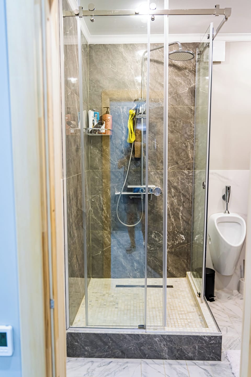 Combined shower/tub, free toiletries, hair dryer, slippers