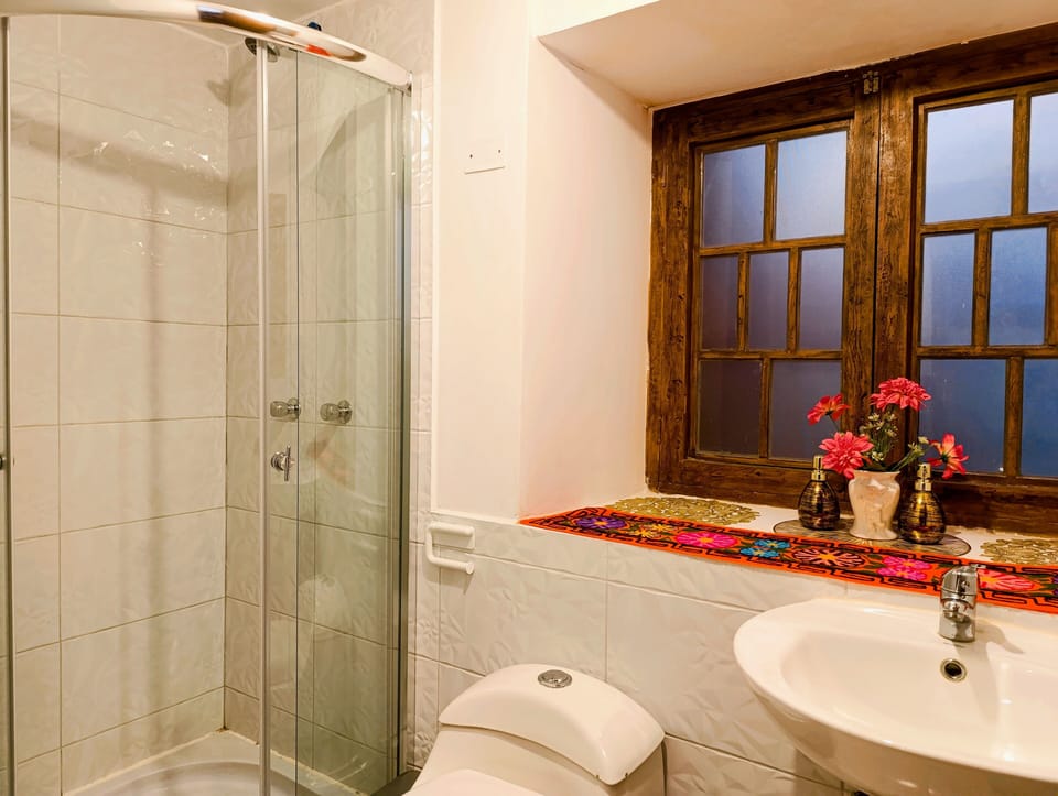Family Quadruple Room | Bathroom | Shower, hair dryer, towels, soap