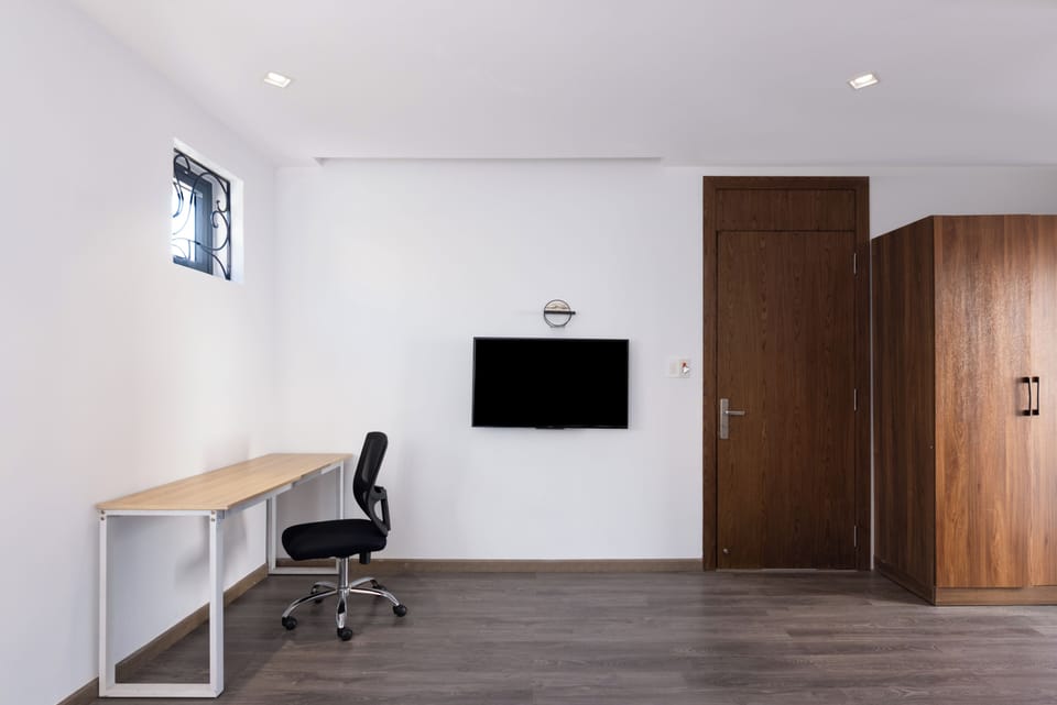 Deluxe Double Room | Minibar, desk, laptop workspace, iron/ironing board