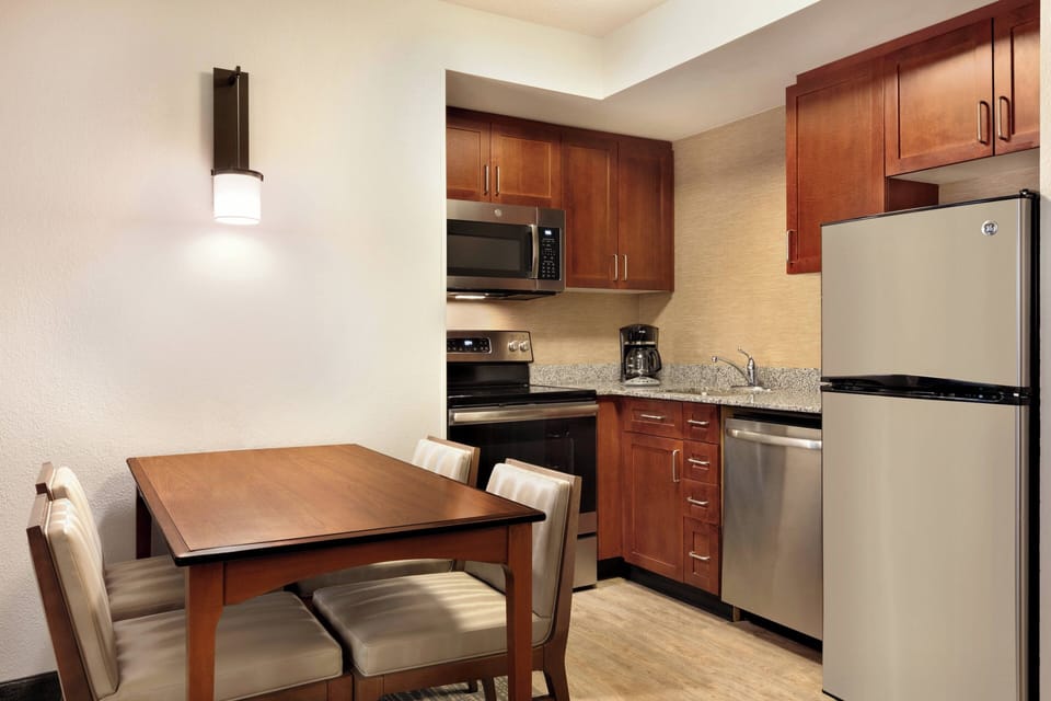 Desk, laptop workspace, blackout drapes, iron/ironing board