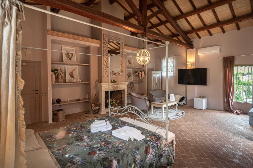 Luxury Suite, Pool View | Down comforters, minibar, individually decorated, individually furnished