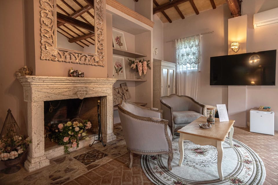 Luxury Suite, Pool View | Down comforters, minibar, individually decorated, individually furnished